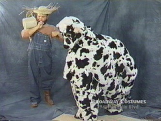 Picture of a 2-person Cow and his  "farmer"