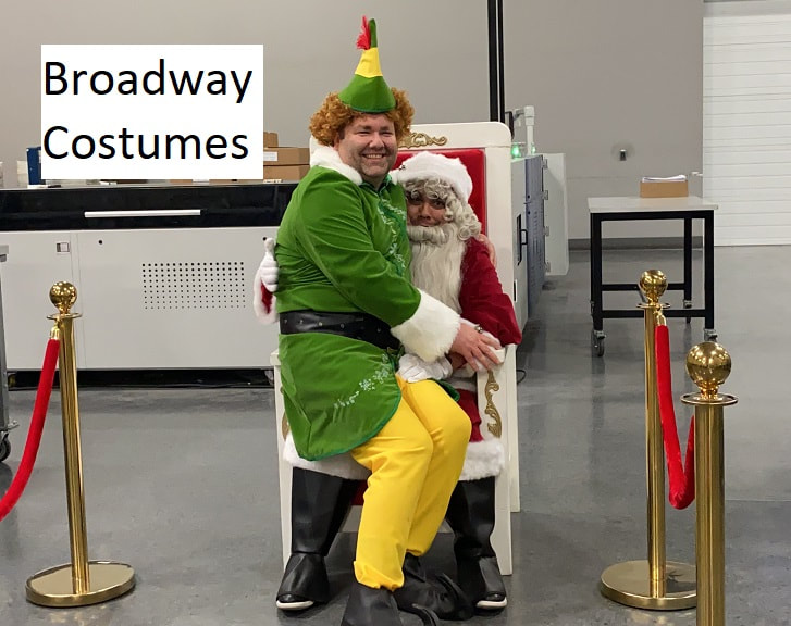 Picture of our buddy the elf costume with our santa costume on one of our thrones with our stanchions