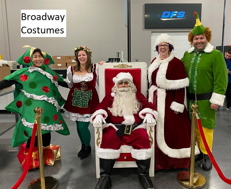 picture of Santa's Menagerie - our Christmas Tree, one of our Santa's Helper Costumes, Santa on our Throne, Santa Belle Costume, and our Buddy the Elf Costume - with our Stanchions